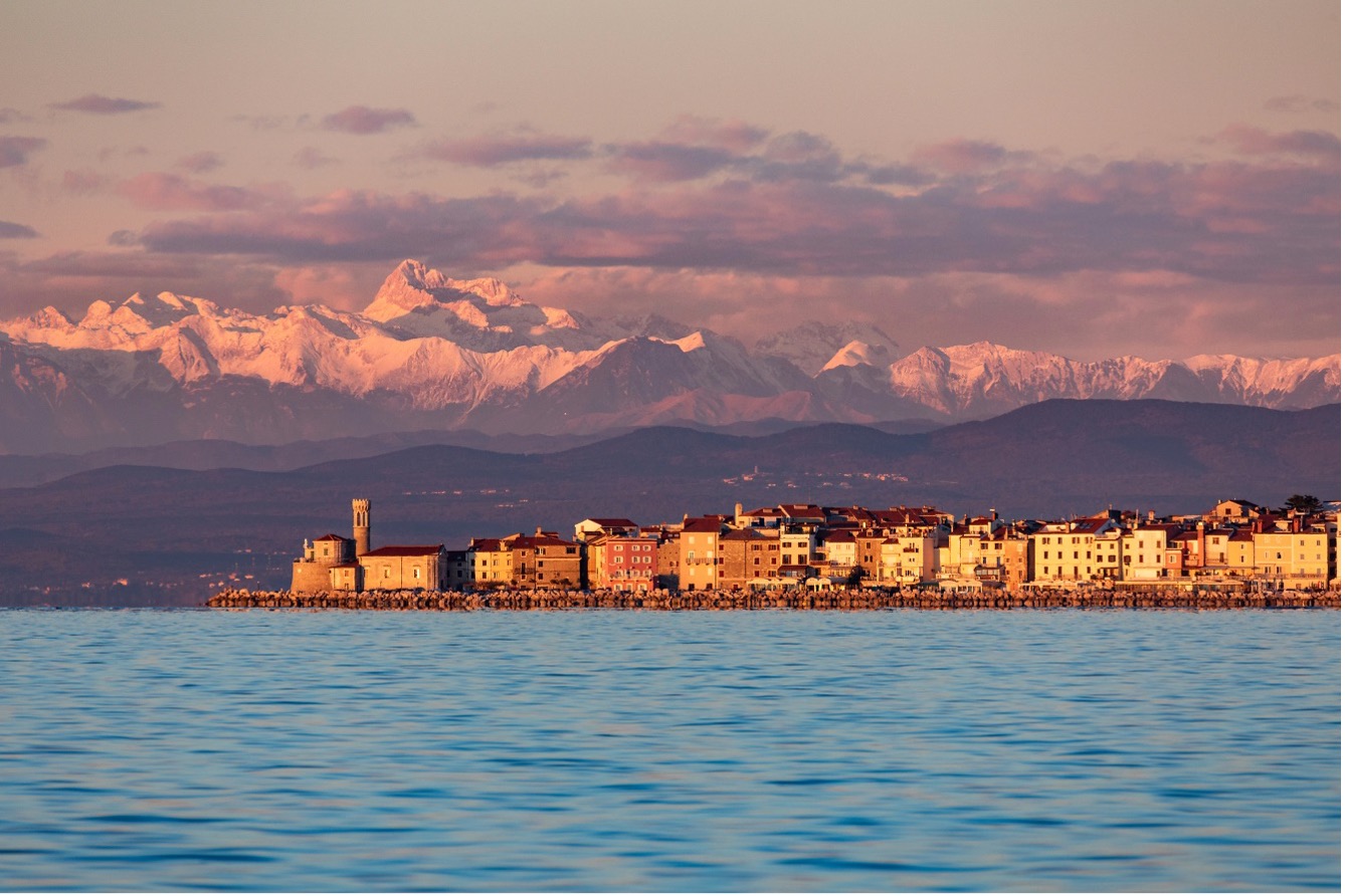 Piran with Triglav in the background, photo: Jošt Gantar